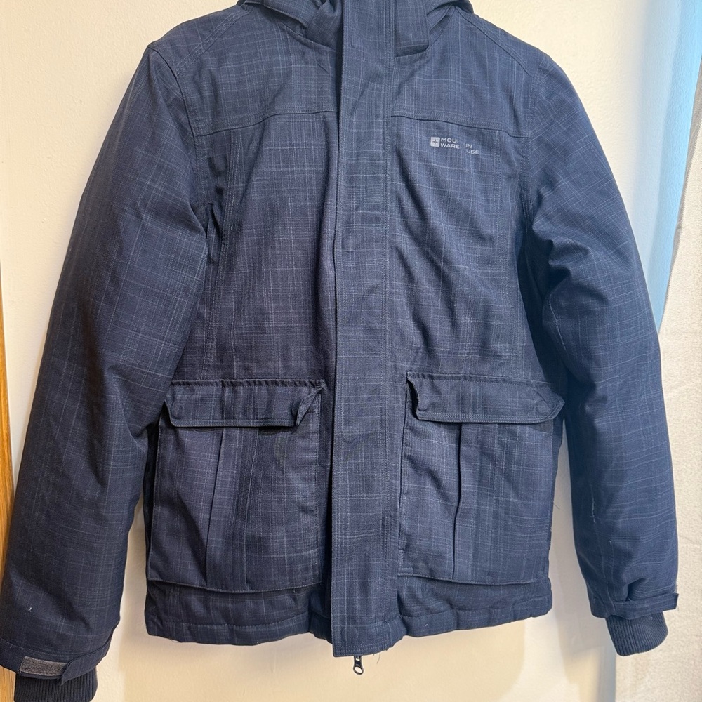 Blue Puffer Jacket with High Collar and Weather-Resistant Material